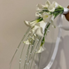 Bridal bouquet of calla lilies with beads and bear grass